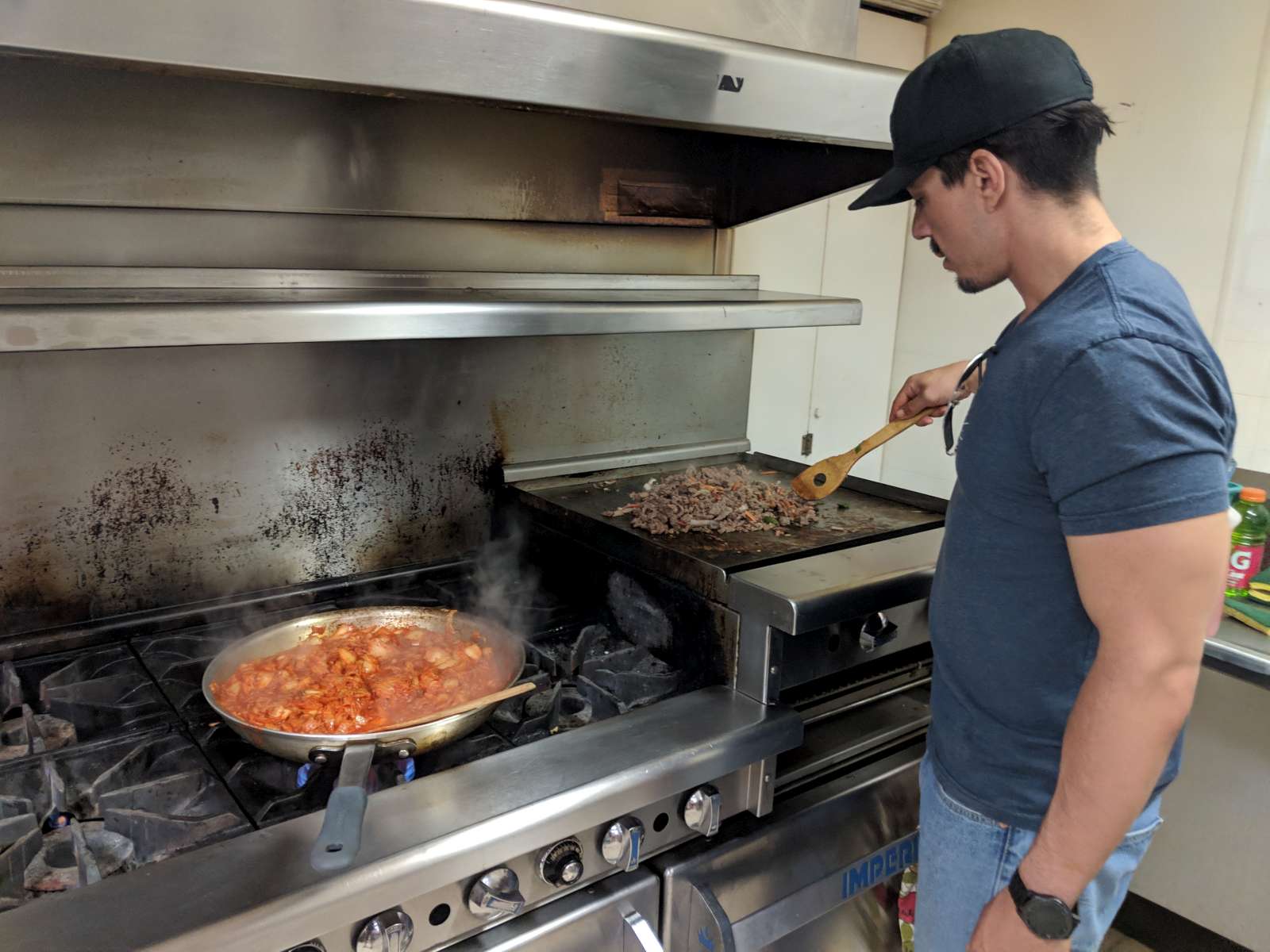 Ben Martinez cooking the meat for the Korean tacos